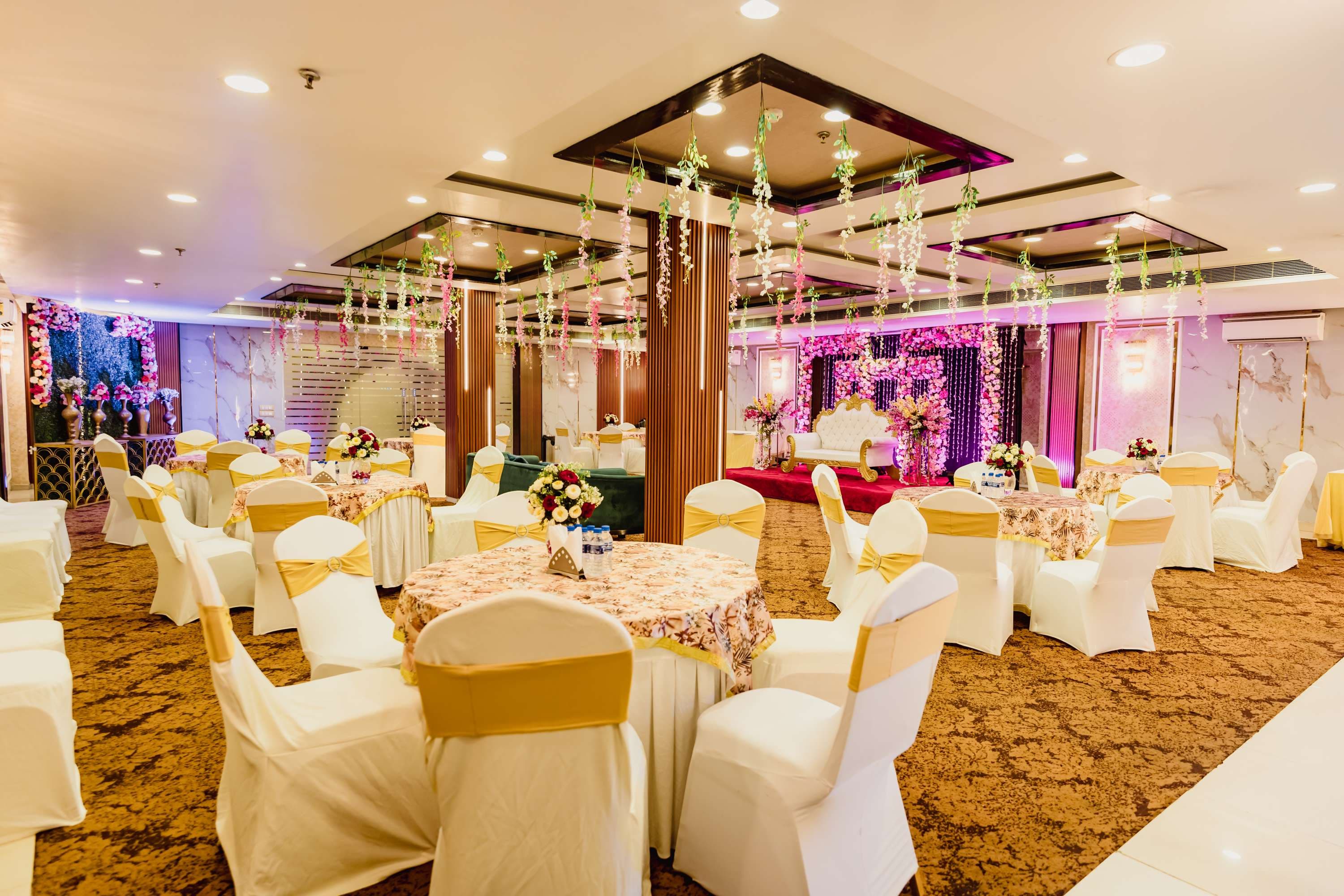 Family gathered at The Grand Orion Banquet Hall during a wedding reception in Kailash Colony